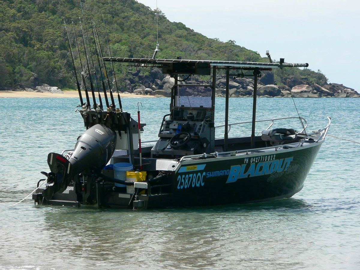 The Blackout Sportsfishing boat — a custom Badjcraft aluminium — moored off a Far North Queensland beach